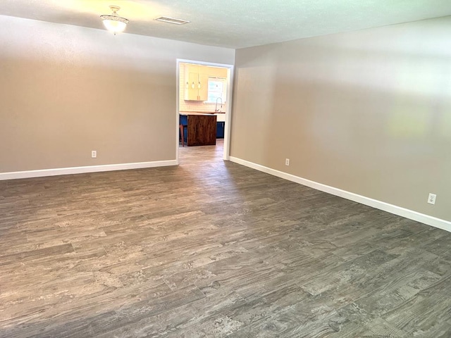 909 Douglas Ave, Midland, TX 79701 - unfurnished room with dark wood finished floors