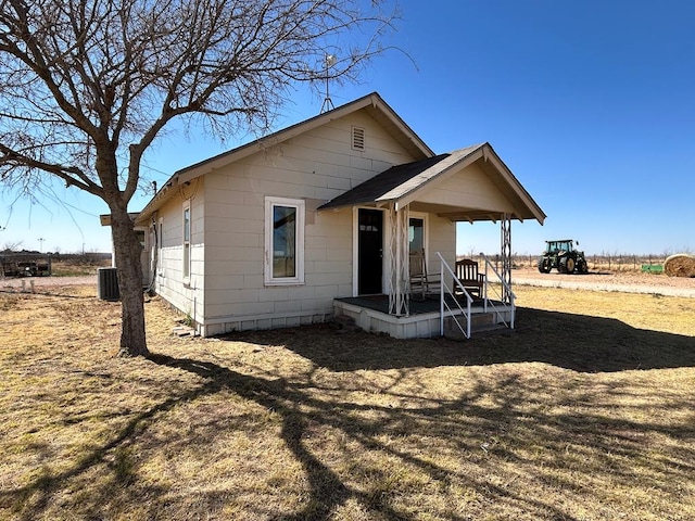 rear view of property with central AC unit