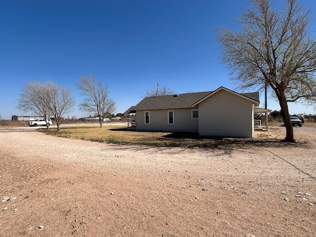 exterior space featuring dirt driveway