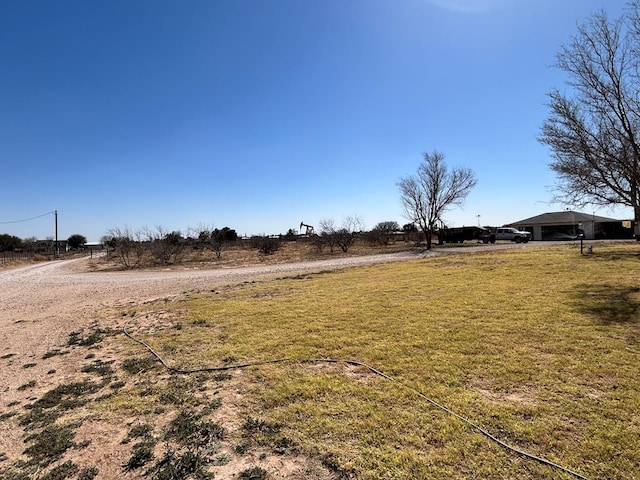 view of yard with a rural view