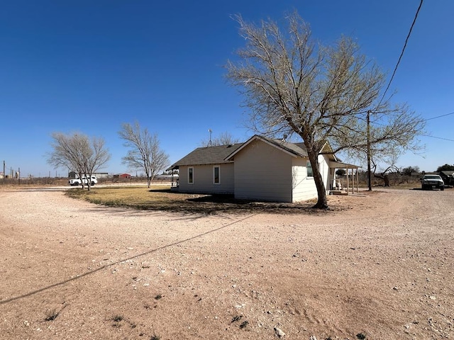 view of side of property featuring driveway