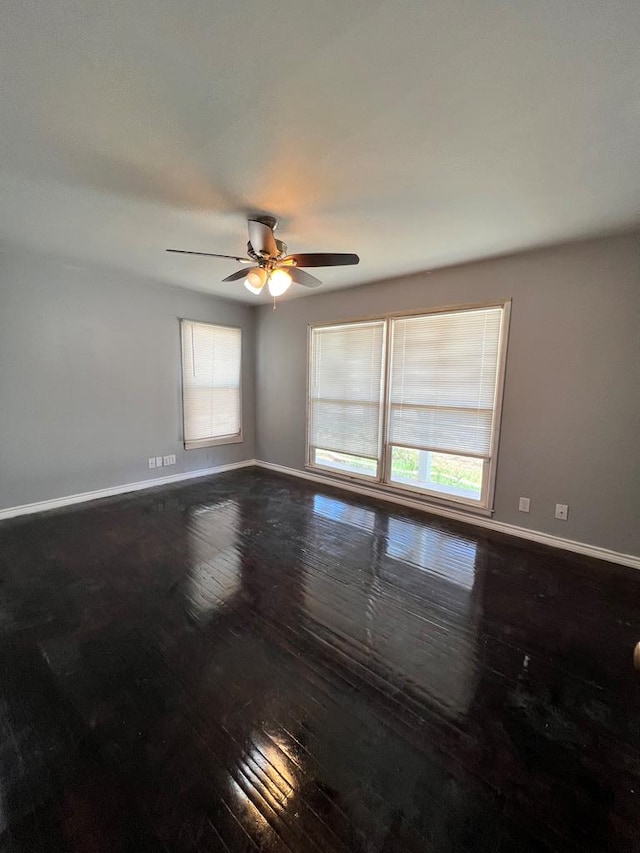 614 W Nobles Ave, Midland, TX 79701 - unfurnished room with hardwood / wood-style flooring, baseboards, and a ceiling fan