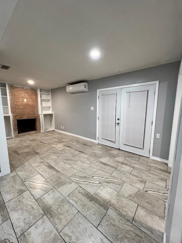614 W Nobles Ave, Midland, TX 79701 - unfurnished living room featuring an AC wall unit, built in features, baseboards, a fireplace, and recessed lighting