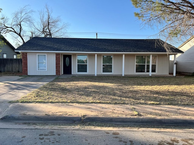 614 W Nobles Ave, Midland, TX 79701 - view of front facade featuring concrete driveway and roof with shingles