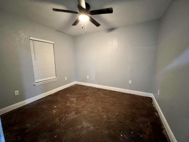 614 W Nobles Ave, Midland, TX 79701 - spare room with unfinished concrete flooring, ceiling fan, and baseboards