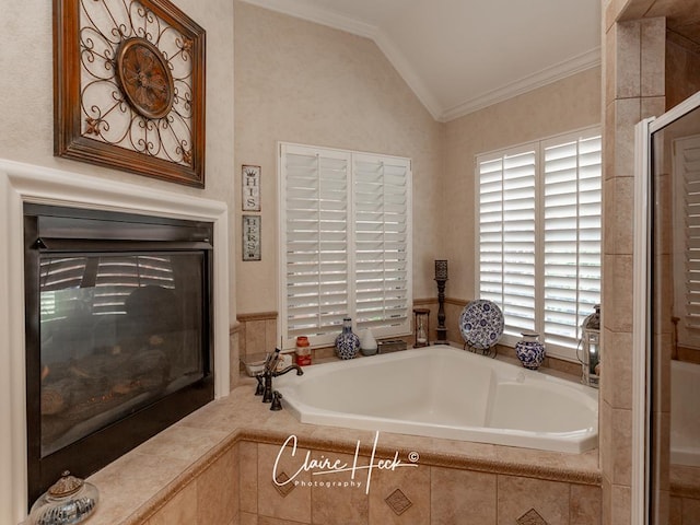 full bath featuring a shower with shower door, crown molding, a garden tub, and vaulted ceiling