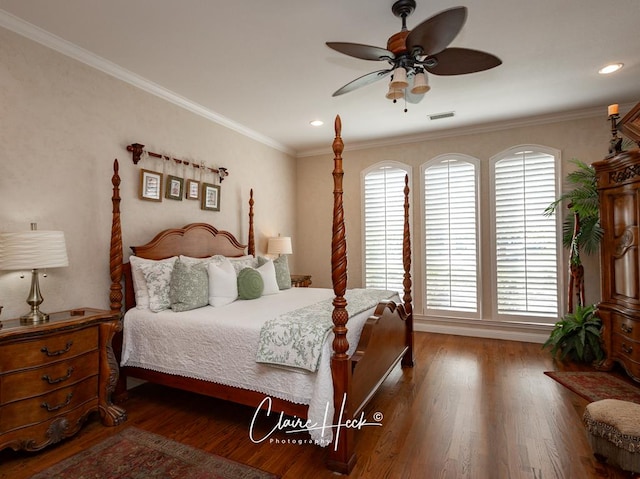 bedroom featuring ceiling fan, dark hardwood / wood-style flooring, and crown molding