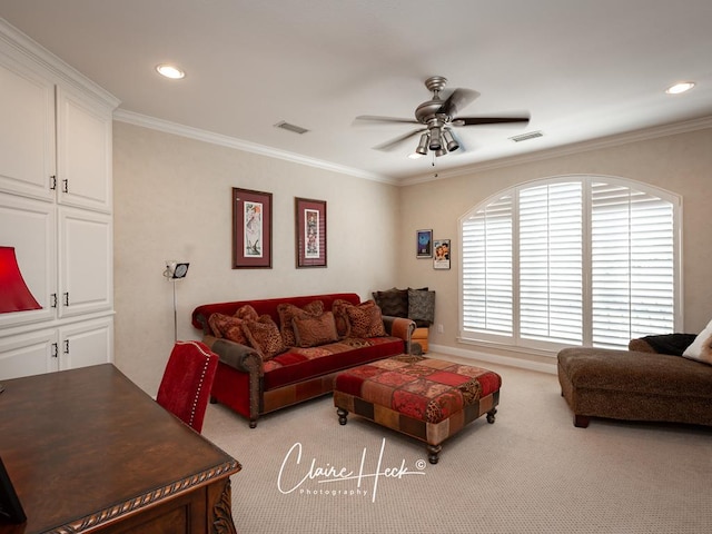 carpeted living room featuring ceiling fan and crown molding