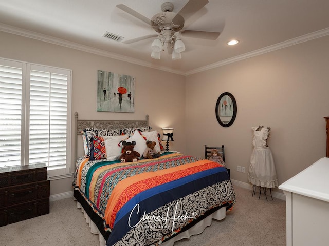 carpeted bedroom with a ceiling fan, baseboards, visible vents, recessed lighting, and crown molding