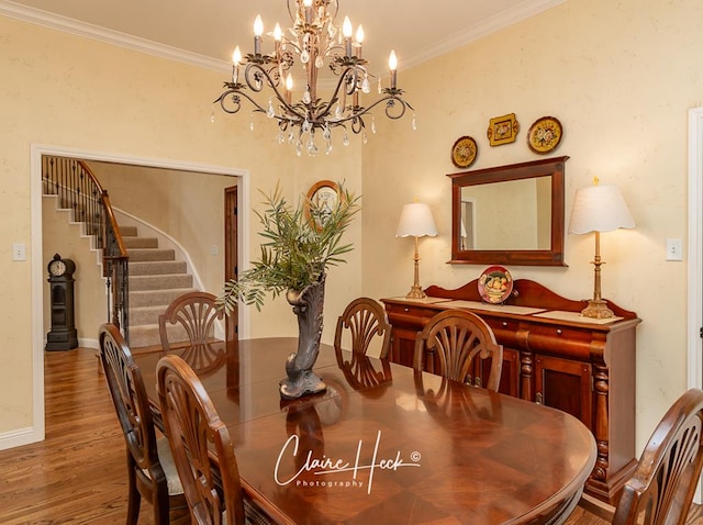 dining room with stairway, baseboards, wood finished floors, and crown molding