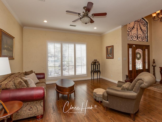 living room featuring recessed lighting, wood finished floors, and ornamental molding