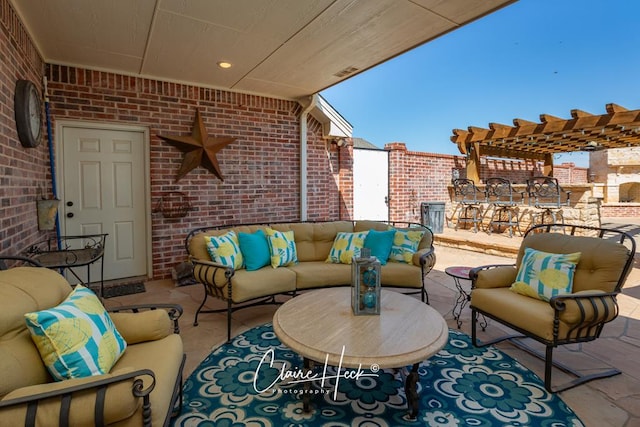 view of patio featuring an outdoor hangout area and a pergola