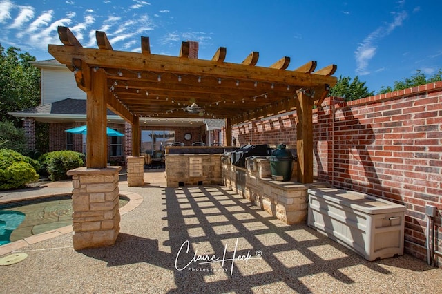 view of patio featuring area for grilling, a pergola, and grilling area