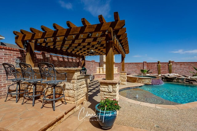 view of patio featuring a pergola, pool water feature, and a pool with hot tub