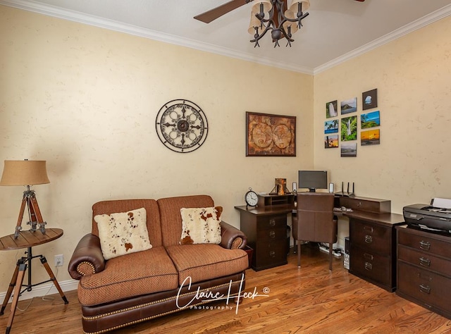 office area featuring ornamental molding, baseboards, and wood finished floors