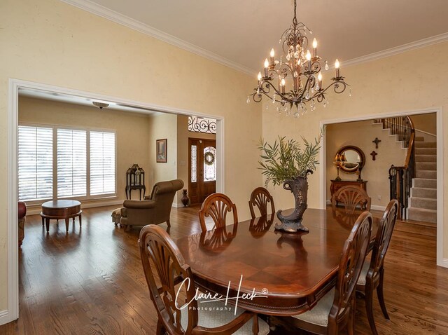 dining area with a notable chandelier, wood finished floors, stairs, and crown molding