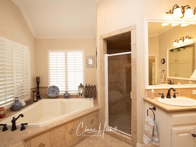 bathroom with vanity, a garden tub, a stall shower, and ornamental molding