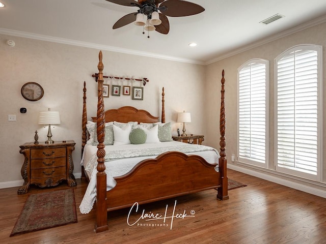 bedroom featuring ceiling fan, crown molding, and hardwood / wood-style flooring