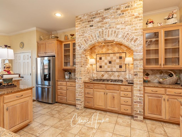 kitchen featuring decorative backsplash, crown molding, and stainless steel appliances