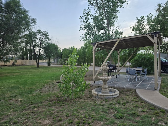 view of yard featuring a patio and fence