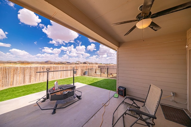 view of patio featuring ceiling fan