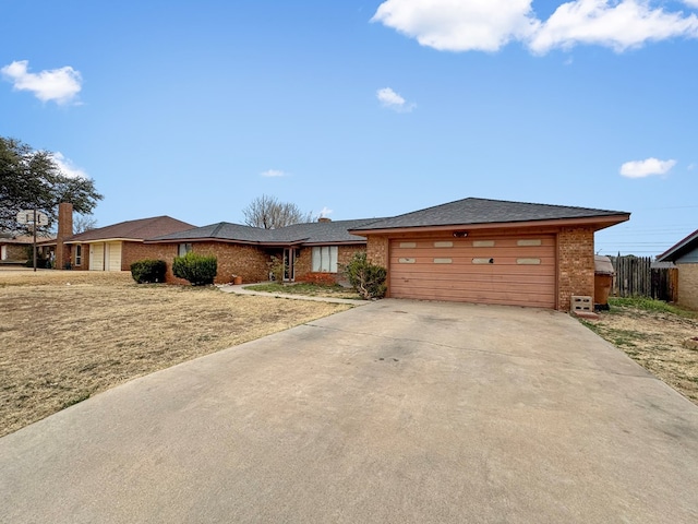 ranch-style house featuring a garage