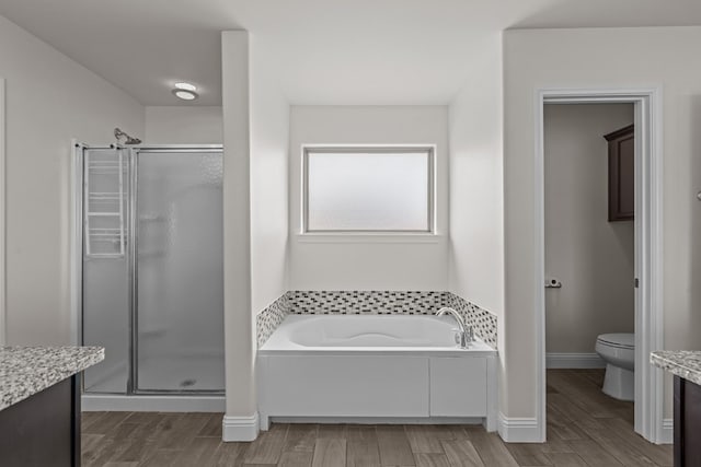 1306 Randolph Ln, Midland, TX 79705 - bathroom featuring a shower stall, vanity, and a bath