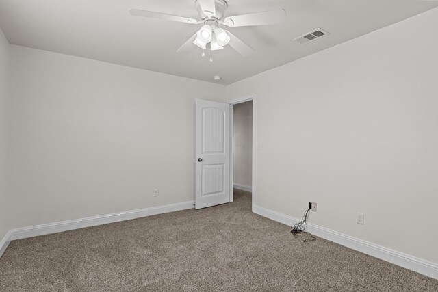 1306 Randolph Ln, Midland, TX 79705 - carpeted empty room featuring baseboards and a ceiling fan