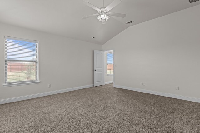 1306 Randolph Ln, Midland, TX 79705 - carpeted empty room with lofted ceiling, a ceiling fan, plenty of natural light, and baseboards