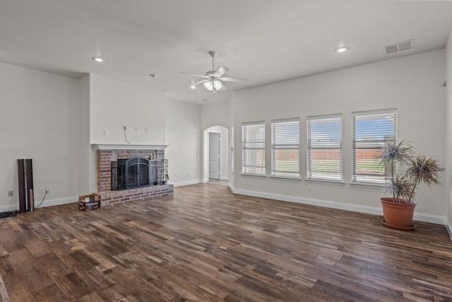 1306 Randolph Ln, Midland, TX 79705 - unfurnished living room with dark wood finished floors, recessed lighting, arched walkways, ceiling fan, and baseboards