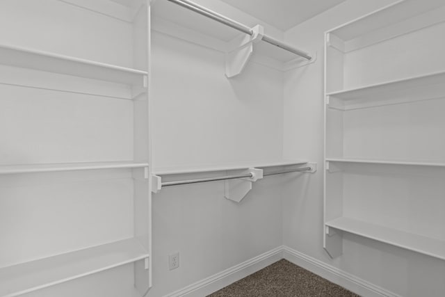 1306 Randolph Ln, Midland, TX 79705 - spacious closet featuring dark carpet