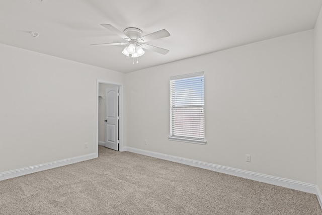 1306 Randolph Ln, Midland, TX 79705 - unfurnished room featuring light carpet, ceiling fan, and baseboards