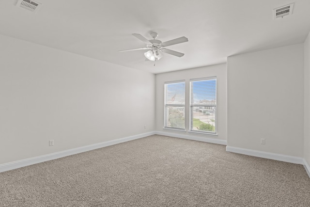 1306 Randolph Ln, Midland, TX 79705 - spare room featuring carpet, a ceiling fan, and baseboards