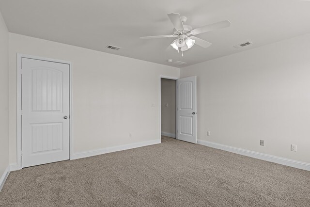 1306 Randolph Ln, Midland, TX 79705 - spare room featuring carpet, baseboards, and ceiling fan