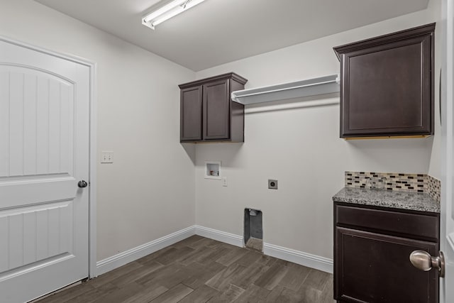 1306 Randolph Ln, Midland, TX 79705 - washroom with washer hookup, dark wood finished floors, electric dryer hookup, cabinet space, and baseboards