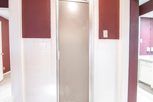 bathroom with vanity and walk in shower