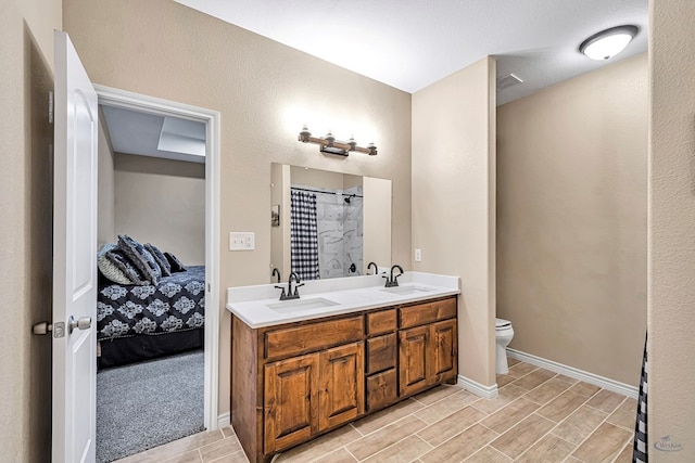 bathroom featuring walk in shower, vanity, and toilet