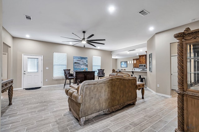 living room with ceiling fan