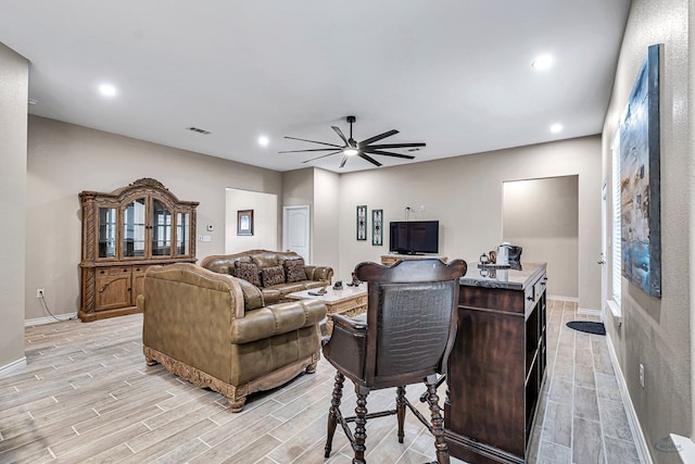 living room with ceiling fan