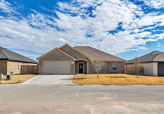 view of front facade with a front yard and a garage