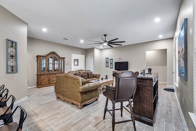 living room with ceiling fan