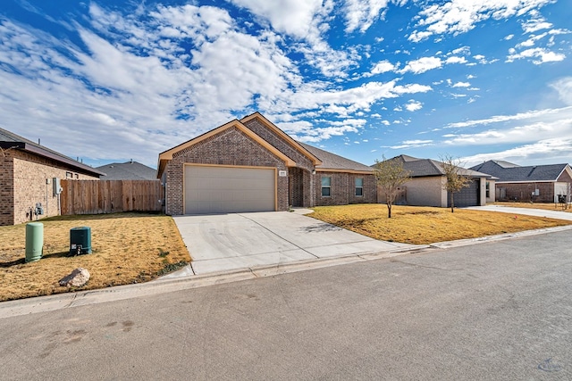 ranch-style home with a front yard and a garage