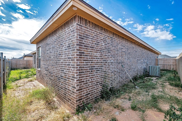 view of side of home with cooling unit