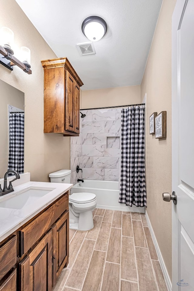 full bathroom featuring vanity, toilet, and shower / bathtub combination with curtain