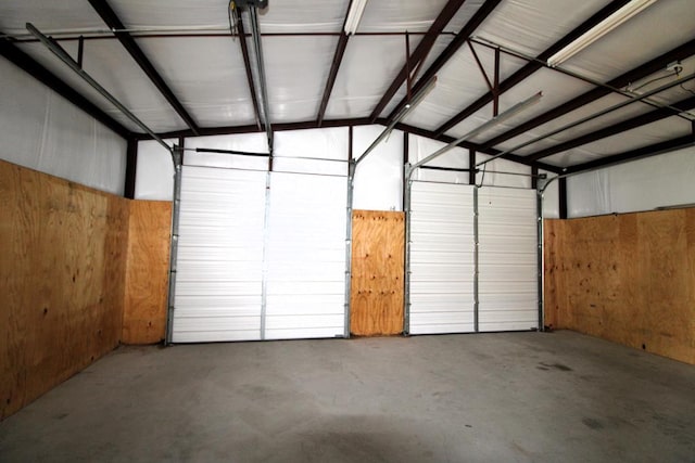 garage featuring wooden walls