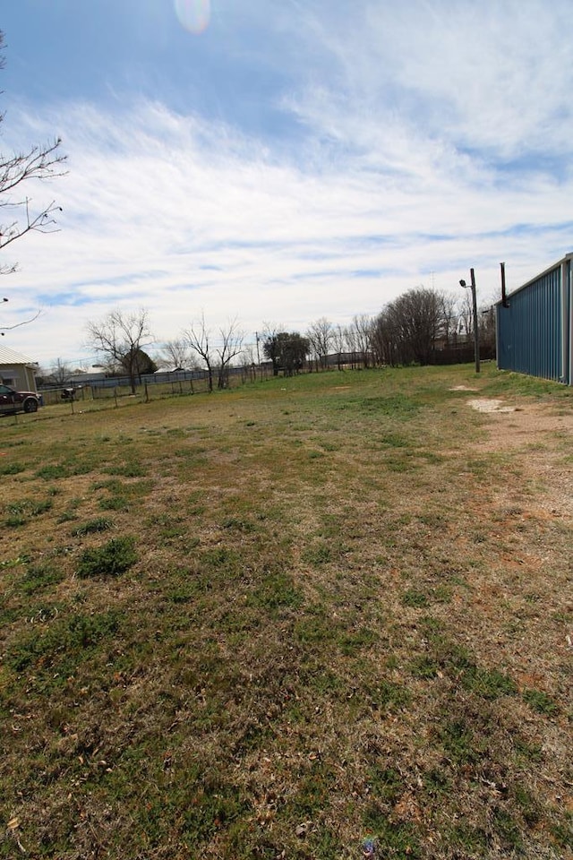 view of yard with a rural view