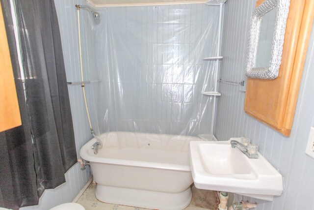 bathroom featuring tile patterned floors, sink, and tiled shower / bath combo