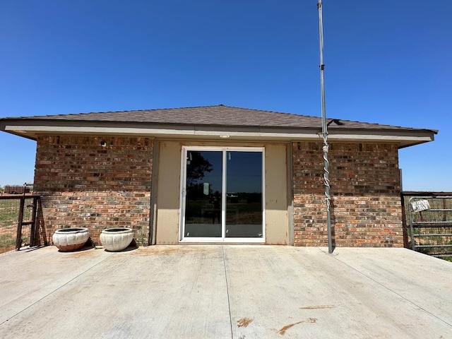 rear view of house featuring a patio