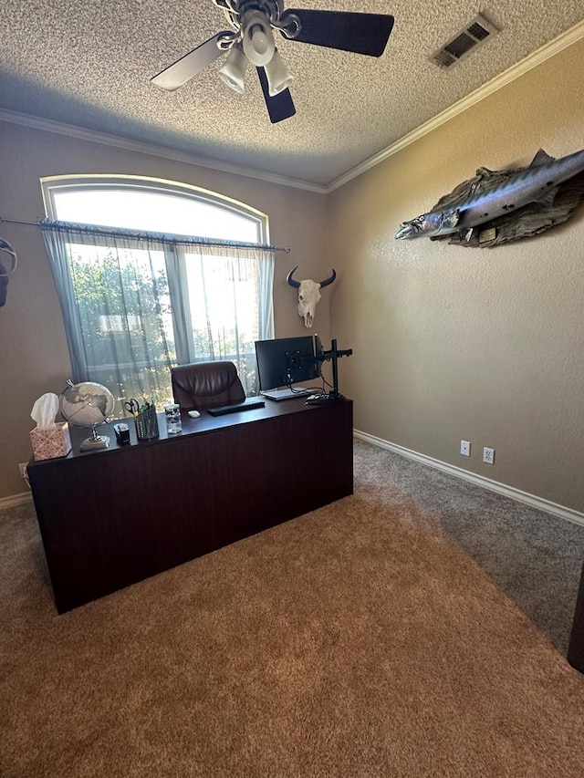 office space with carpet, a textured ceiling, ceiling fan, and ornamental molding