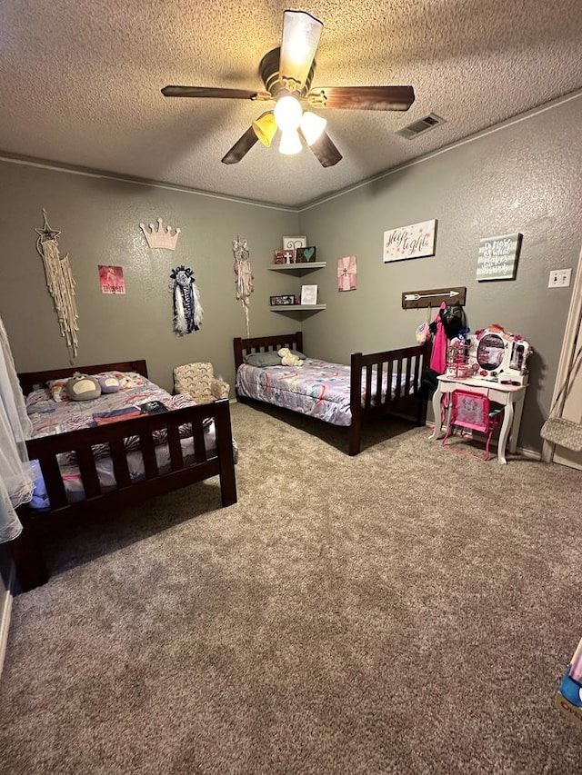 carpeted bedroom with ceiling fan and a textured ceiling